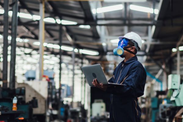 Business professionals meeting with safety helmet